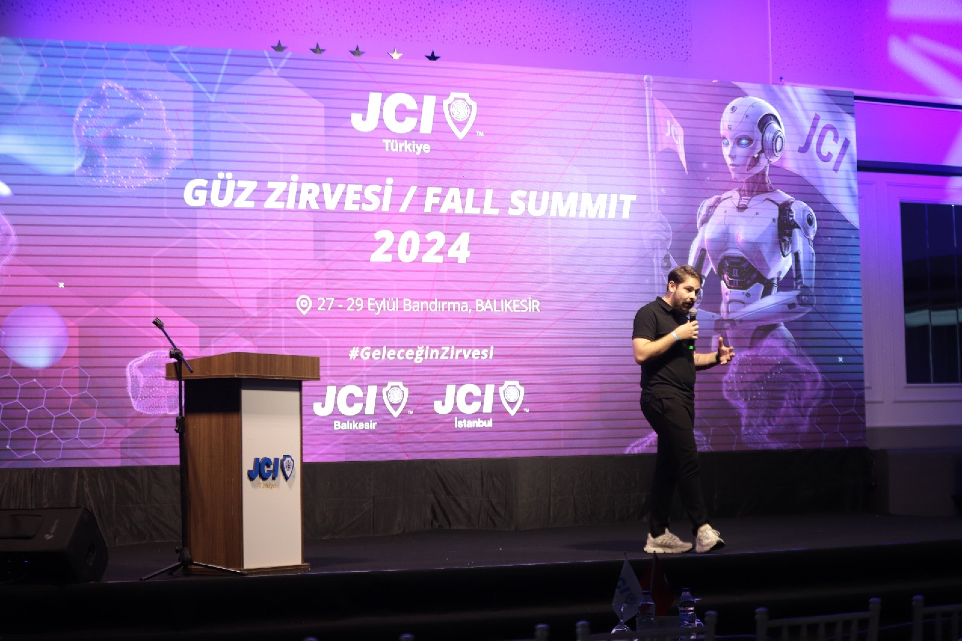 Sabah Kemal Cansu speaking on stage at JCI Türkiye Fall Summit 2024